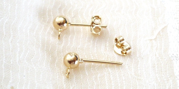 GFA-07404C_1 Goldfilled Oro Laminado 14k Arete Broquel. 4mm. 1 par.